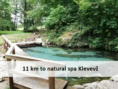 a sign that reads km to natural spa kewyrysicalysicalysicalysical at Tiny House - Glamping Paradise Skatlar 45722 in Otočec
