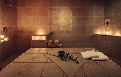 a bathroom with a shower with figurines on the floor at 2 Bedroom Awesome Apartment In Pohorje in Pohorje