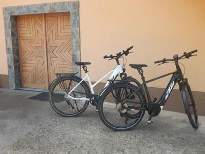 two bikes parked next to a building with a door at Holiday home in Otocec - Kranjska (Krain) 26040 in Otočec
