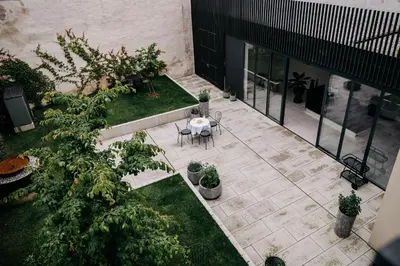 an overhead view of a patio with a table and plants at Villa Elizabeth - Apartment with Garden in Slovenj Gradec