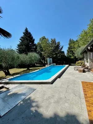 a swimming pool in the backyard of a house at Vila Giovana in Vipava