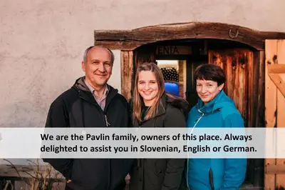 a group of people standing in front of a door at Vineyard Cottage Skatlar 2 in Srednje Grčevje