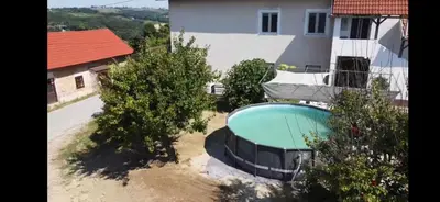 an aerial view of a house with a swimming pool at Apartma Minka in Miklavž pri Ormožu
