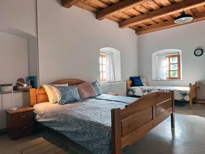 a bedroom with a bed and two beds at Holiday home in Semic - Kranjska (Krain) 51757 in Semič