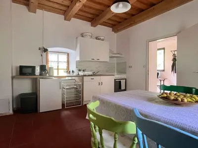 a kitchen with a table with a bowl of fruit on it at Holiday home in Semic - Kranjska (Krain) 51757 in Semič