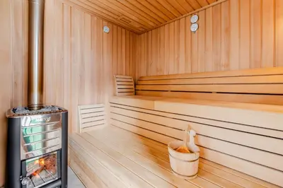 a sauna with a trash can in the middle at Penzion Hosnar, apartma Mucho in Bovec