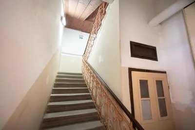 a stairway in a building with a door at Apartma Pri Kosu in Slovenska Bistrica