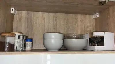 a shelf with two white bowls and a blender at Cosy Corner Vič in Ljubljana