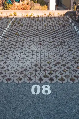 a parking lot with a number on the ground at Maribella Apartment II in Maribor