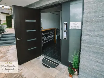 a door to a restaurant with a sign on it at Bled Prestigious and Stylish Apartments - Standard Studio Apartment with Terrace in Bled
