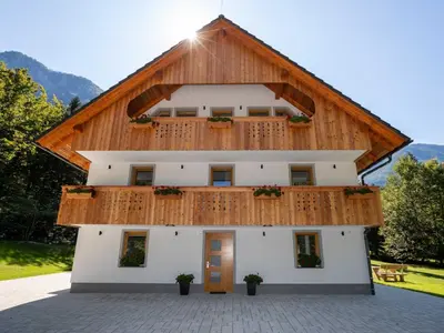a building with a wooden roof at The Woodland Nook Apartments Bohinj - Standard Two Bedroom Apartment with Balcony in Bohinj