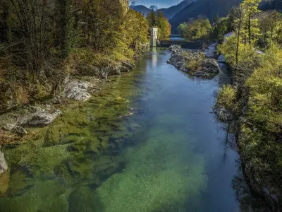 an aerial view of a river with trees and a bridge at Riverside Rustic Ridge Apartments with Balcony - Three Bedroom Apartment with Balcony in Slappe dʼIdria