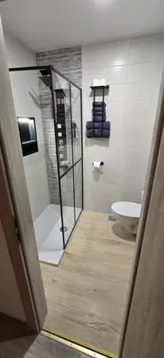 a bathroom with a shower and a toilet and a sink at Kajžarka in Miklavž pri Ormožu