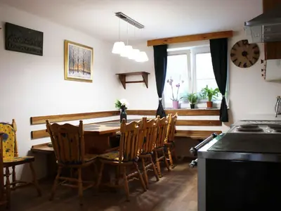 a dining room with a table and chairs and a window at Holiday Home with A - C in Zgornji Leskovec 54833 in Zgornji Leskovec