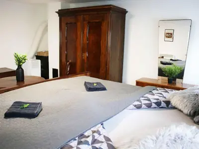 a bedroom with a bed with two towels on it at Holiday Home with A - C in Zgornji Leskovec 54833 in Zgornji Leskovec