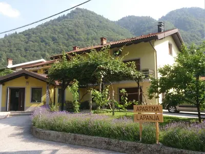 a house with a sign in front of it at Apartment Wohnung Lapanja 2 mit Gemeinschaftsgarten by Interhome in Slappe dʼIdria