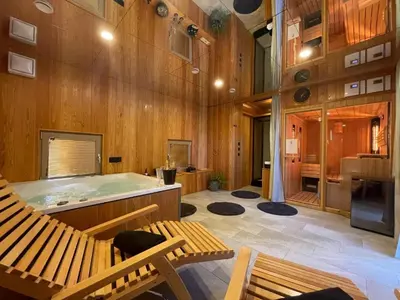 a hot tub in a room with wooden walls at VRBA Premium riverside mobile house BIG BERRY in Gradac
