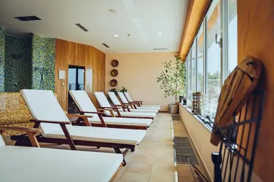 a row of chairs in a waiting room at Pohorje Village Wellbeing Resort - Forest Hotel Videc in Pohorje