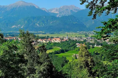 a town in a valley with mountains in the background at Wooden Cabin Kamna Gorica in Kamna Gorica