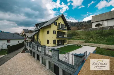 an aerial view of a house with a balcony at Bled Paradise Apartments in Bled