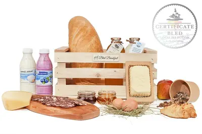 a crate filled with bread and other food items at Apartments Vidic in Bled