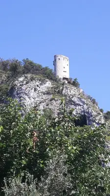 a castle on top of a hill with trees at Relax in Črni Kal in Črni Kal