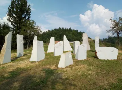 a group of white monuments sitting in a field at Hillside Bio Resort Delux Apartments in Šešče pri Preboldu