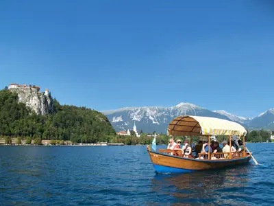 a group of people on a boat on the water at Apartma AS in Bled