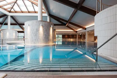 a large swimming pool in a building at Hotel Ajda - Terme 3000 - Sava Hotels & Resorts in Moravske Toplice