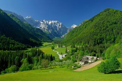 a green valley with a river and mountains at Shepherds House 