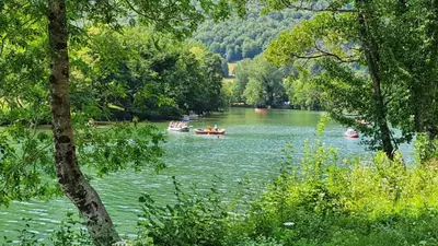 a group of people in boats on a river at Vila Fani, Kostel - vacation house Pr' Vili Fani in Kostel