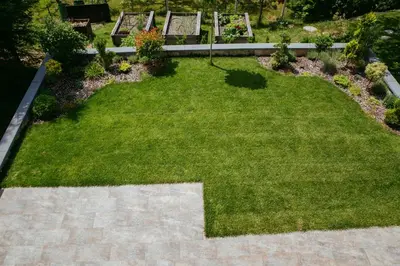 a lawn with two benches in a garden at Apartment Oddih with terrace and private SAUNA in Bled