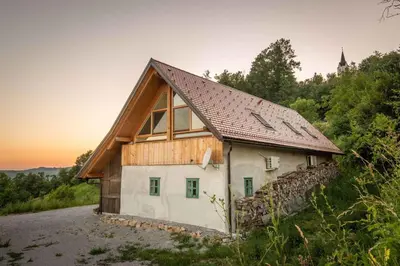 a house with a wooden roof on a hill at Holiday home in Otocec Kranjska Krain 42907 in Otočec
