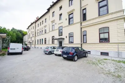 a group of cars parked in front of a building at Apartment for four with free parking in Ljubljana
