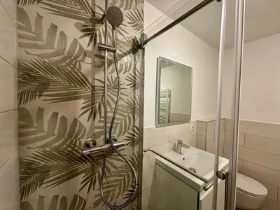 a bathroom with a shower and a sink at Sava View 8 in Ribno