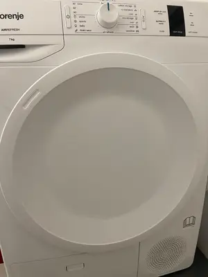 a white washing machine with its door open at ICE APARTMENT in Ljubljana